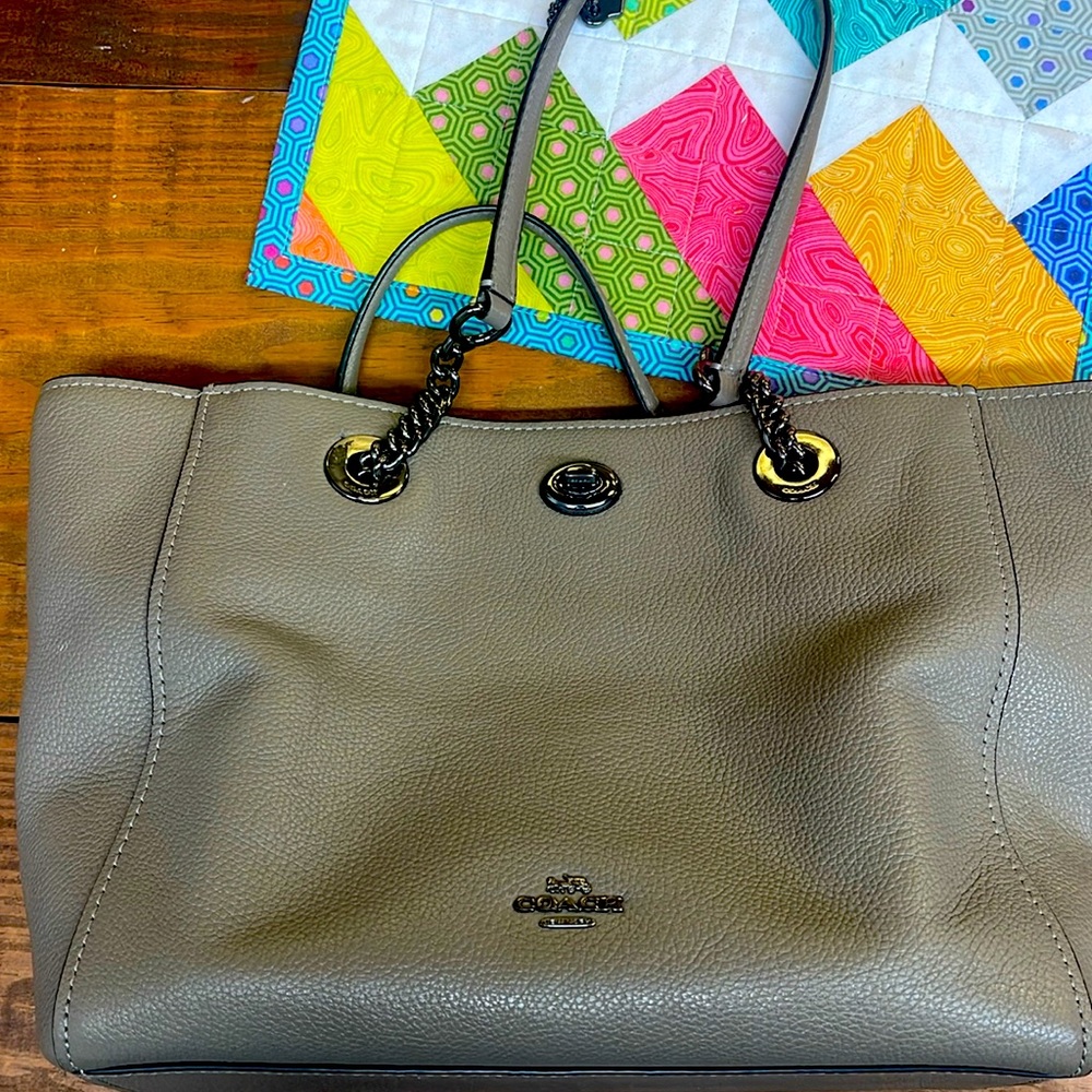 Coach purse 10.5” wide, bottom is 3.5”, 9” tall, 10” gun metal hardware.